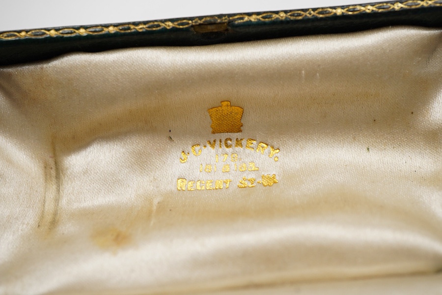 A late 19th century yellow metal and polychrome enamel desk seal, with rock crystal matrix, carved with a monogram, 69mm (small chip to the enamel), in original J.C Vickery fitted gilt tooled leather box.